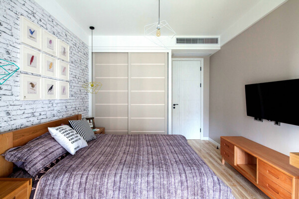 现代清新卧室蓝色花纹背景墙室内装修效果图