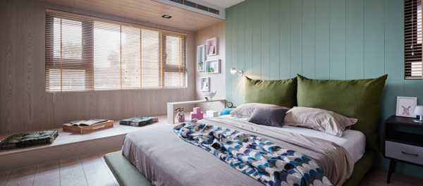 现代时尚卧室浅蓝色背景墙室内装修效果图