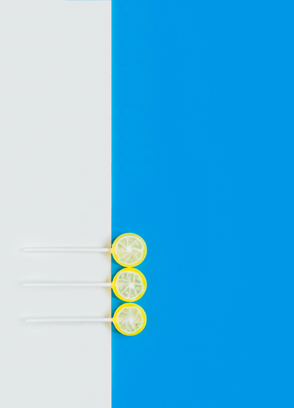 蓝色柠檬棒棒糖零食背景海报素材图片